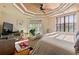 King-size bedroom with access to private balcony at 5209 Manorwood Dr # 3A, Sarasota, FL 34235