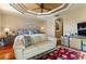 Primary bedroom with sitting area and hardwood floors at 5209 Manorwood Dr # 3A, Sarasota, FL 34235