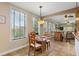 Cozy breakfast nook with granite table and two chairs at 5209 Manorwood Dr # 3A, Sarasota, FL 34235