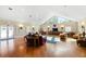 Spacious community room with hardwood floors and comfy seating at 5209 Manorwood Dr # 3A, Sarasota, FL 34235