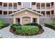 Circular walkway leading to the condo building entrance at 5209 Manorwood Dr # 3A, Sarasota, FL 34235