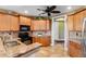 L-shaped kitchen with granite countertops and black appliances at 5209 Manorwood Dr # 3A, Sarasota, FL 34235