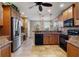 Eat-in kitchen with stainless steel appliances and tile flooring at 5209 Manorwood Dr # 3A, Sarasota, FL 34235