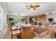 Kitchen with breakfast bar and view into living area at 5209 Manorwood Dr # 3A, Sarasota, FL 34235