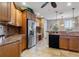 Updated kitchen with stainless steel appliances and granite countertops at 5209 Manorwood Dr # 3A, Sarasota, FL 34235