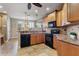 Modern kitchen with black appliances and granite countertops at 5209 Manorwood Dr # 3A, Sarasota, FL 34235
