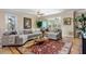 Large living room with sectional sofa and access to balcony at 5209 Manorwood Dr # 3A, Sarasota, FL 34235