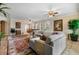 Spacious living room featuring a large sectional sofa and area rug at 5209 Manorwood Dr # 3A, Sarasota, FL 34235