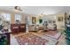 Spacious living room with large windows and comfortable seating at 5209 Manorwood Dr # 3A, Sarasota, FL 34235