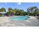 Relaxing community pool with lounge chairs and a spa at 5209 Manorwood Dr # 3A, Sarasota, FL 34235