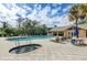 Community pool and spa with plenty of lounge chairs at 5209 Manorwood Dr # 3A, Sarasota, FL 34235