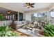 Relaxing sunroom with wicker furniture and sliding glass doors at 5209 Manorwood Dr # 3A, Sarasota, FL 34235