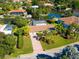 Bird's-eye view of single-story home, landscaped yard, and brick driveway at 5537 Cape Leyte Dr, Sarasota, FL 34242