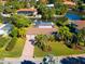 Aerial view showcasing a house with a pool and canal access at 5537 Cape Leyte Dr, Sarasota, FL 34242