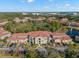 Aerial view of condo building showcasing its architecture and landscaping at 5601 Bentgrass Dr # 10-112, Sarasota, FL 34235