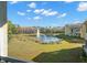 Luxury community with lake, fountain, and lush landscaping at 5601 Bentgrass Dr # 10-112, Sarasota, FL 34235