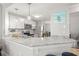 Modern kitchen with granite countertops, stainless steel appliances, and pendant lighting at 5601 Bentgrass Dr # 10-112, Sarasota, FL 34235