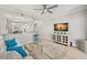 Open living space with white couch and kitchen views at 5601 Bentgrass Dr # 10-112, Sarasota, FL 34235