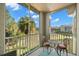Relaxing screened patio with a table set and nature views at 5601 Bentgrass Dr # 10-112, Sarasota, FL 34235