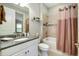 Updated bathroom featuring granite vanity, soaking tub, and shower at 5652 Semolino St, Nokomis, FL 34275