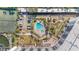 Community pool area with ample seating and lush landscaping at 5855 Midnight Pass Rd # 511, Sarasota, FL 34242