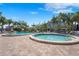 Community pool area with hot tub and lounge chairs at 5855 Midnight Pass Rd # 511, Sarasota, FL 34242