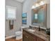 Guest bathroom with single vanity and granite countertop at 5868 Meriwether Pl, Sarasota, FL 34232