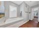 Spa-like bathroom with soaking tub and walk-in shower at 5868 Meriwether Pl, Sarasota, FL 34232
