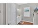 Bathroom with double vanity, marble countertop, and large mirror at 5868 Meriwether Pl, Sarasota, FL 34232