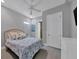 Charming bedroom with a queen-size bed and floral bedding at 5868 Meriwether Pl, Sarasota, FL 34232