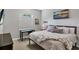 Guest bedroom with a queen bed and built-in desk at 5868 Meriwether Pl, Sarasota, FL 34232