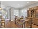 Bright dining room features a wood table, bench, and built-in hutch at 5868 Meriwether Pl, Sarasota, FL 34232