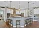 Modern kitchen with a large island, stainless steel appliances, and granite countertops at 5868 Meriwether Pl, Sarasota, FL 34232
