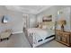 Spacious main bedroom with king-size bed and ensuite bathroom at 5868 Meriwether Pl, Sarasota, FL 34232