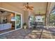 Covered patio with seating area, adjacent to the pool and Gathering room at 5868 Meriwether Pl, Sarasota, FL 34232