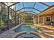 Relaxing screened-in pool and spa area, perfect for outdoor enjoyment at 5868 Meriwether Pl, Sarasota, FL 34232