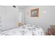 Well-lit bedroom with a full-sized bed and dresser at 5902 Garden Ln # A24, Bradenton, FL 34207