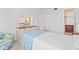 Bright bedroom with a full-sized bed and dresser at 5902 Garden Ln # A24, Bradenton, FL 34207
