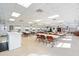 Spacious community room with tables and chairs at 5902 Garden Ln # A24, Bradenton, FL 34207