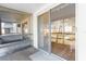 Bright lanai with glass sliding doors leading to a view of lush landscaping at 5902 Garden Ln # A24, Bradenton, FL 34207