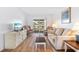 Bright living room with hardwood floors and patio access at 5902 Garden Ln # A24, Bradenton, FL 34207