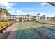Outdoor shuffleboard courts with benches, situated near community building at 5902 Garden Ln # A24, Bradenton, FL 34207