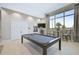 Game Room features a pool table and seating area with large windows at 6324 Plateau Ct, Bradenton, FL 34203