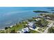 Stunning waterfront property with expansive lawn, private dock, and panoramic bay views at 7418 Westmoreland Dr, Sarasota, FL 34243
