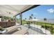 Outdoor oasis with a pool, patio furniture, and stunning water views at 7418 Westmoreland Dr, Sarasota, FL 34243