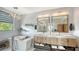 Spa-like bathroom with double vanity, soaking tub, and walk-in shower at 7418 Westmoreland Dr, Sarasota, FL 34243