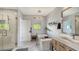 Modern bathroom with soaking tub, walk-in shower, and double vanity at 7418 Westmoreland Dr, Sarasota, FL 34243
