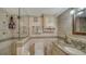 Clean bathroom with granite countertop and updated shower at 7418 Westmoreland Dr, Sarasota, FL 34243