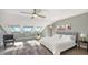 Bright bedroom with a king-size bed and stunning water views at 7418 Westmoreland Dr, Sarasota, FL 34243