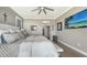 Spacious main bedroom with large bed, water view, and plenty of natural light at 7418 Westmoreland Dr, Sarasota, FL 34243